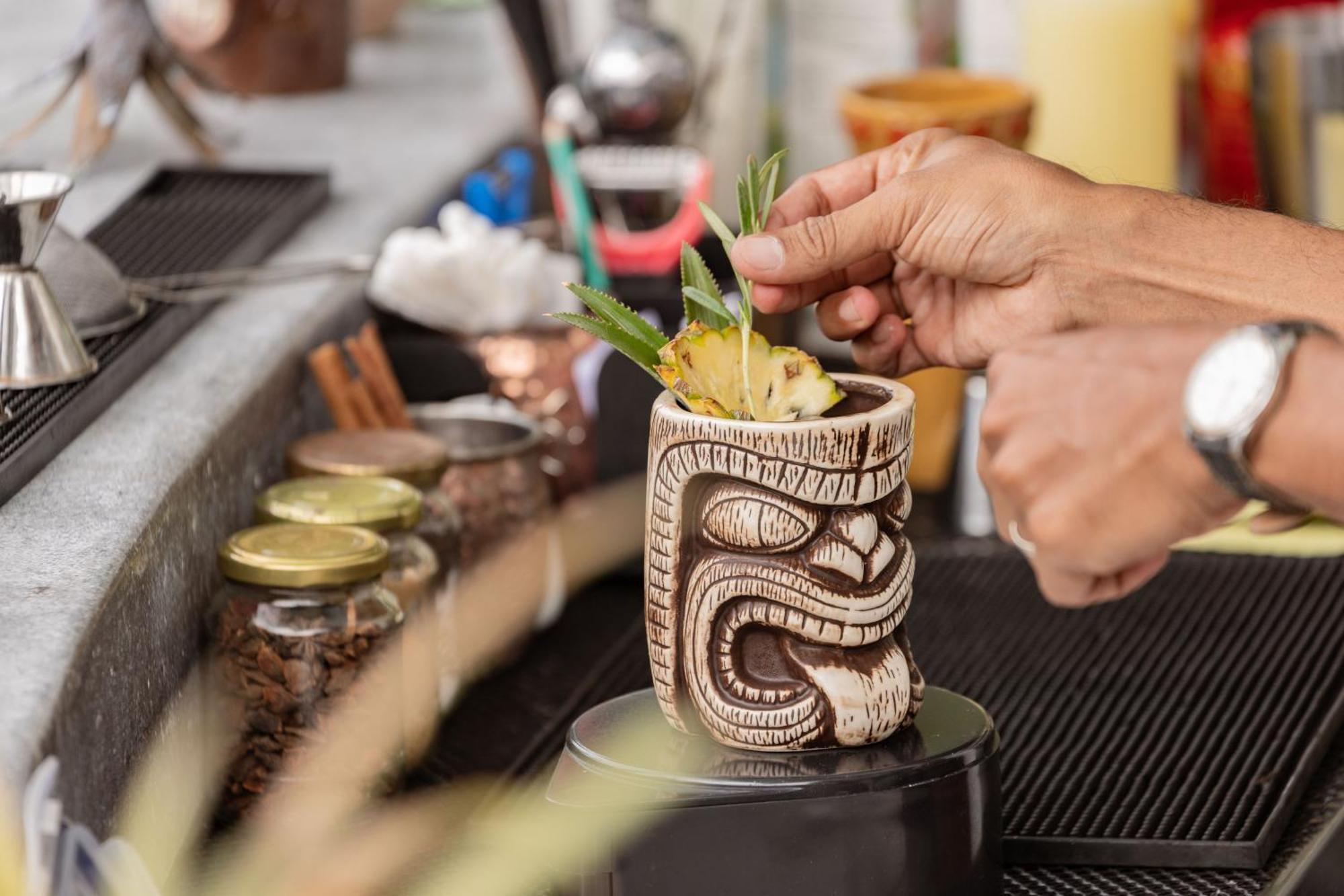 Skyview Resort Phuket Patong Beach Экстерьер фото A tiki drink being garnished
